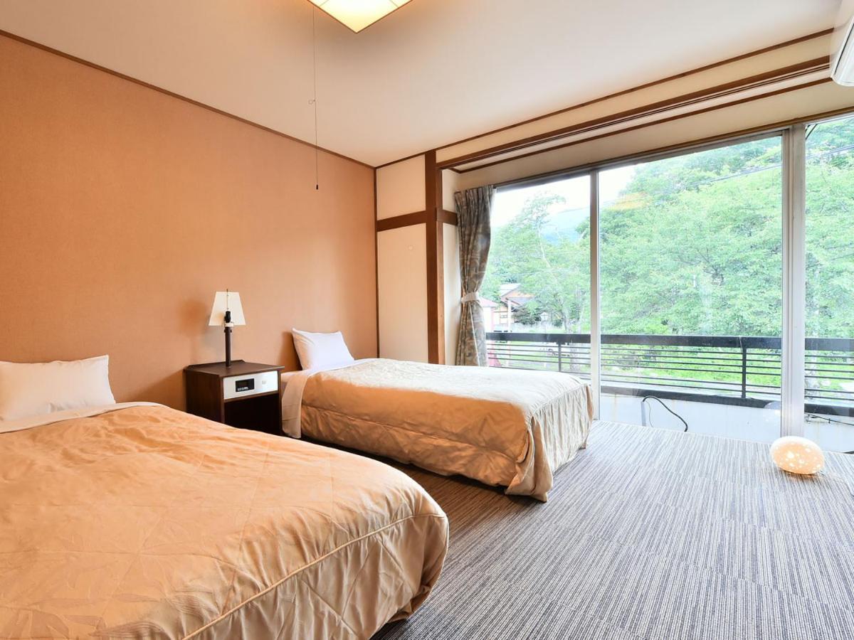 Alpine Route Hotel Омати Экстерьер фото